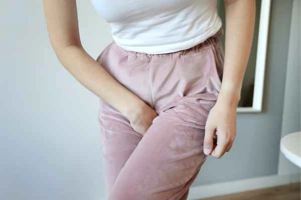 older woman running to the toilet because of urinary incontinence Ossett